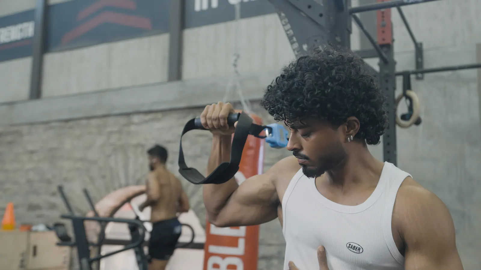 Athlete pulling against a strap-mounted strength meter during an EvoQuest test